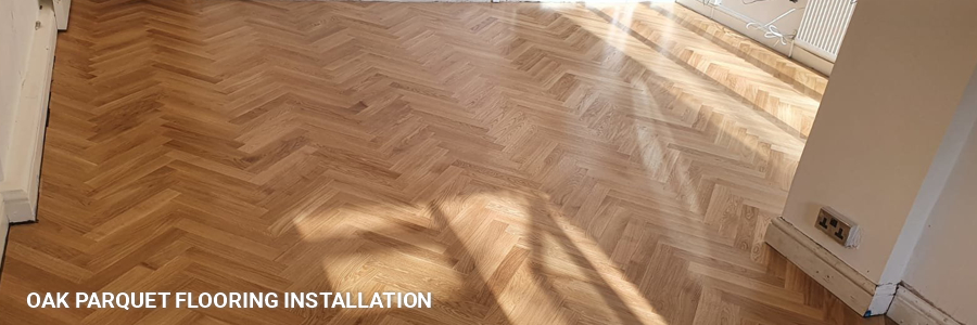 Solid Oak Parquet Floor Fitting 22 in fortis-green